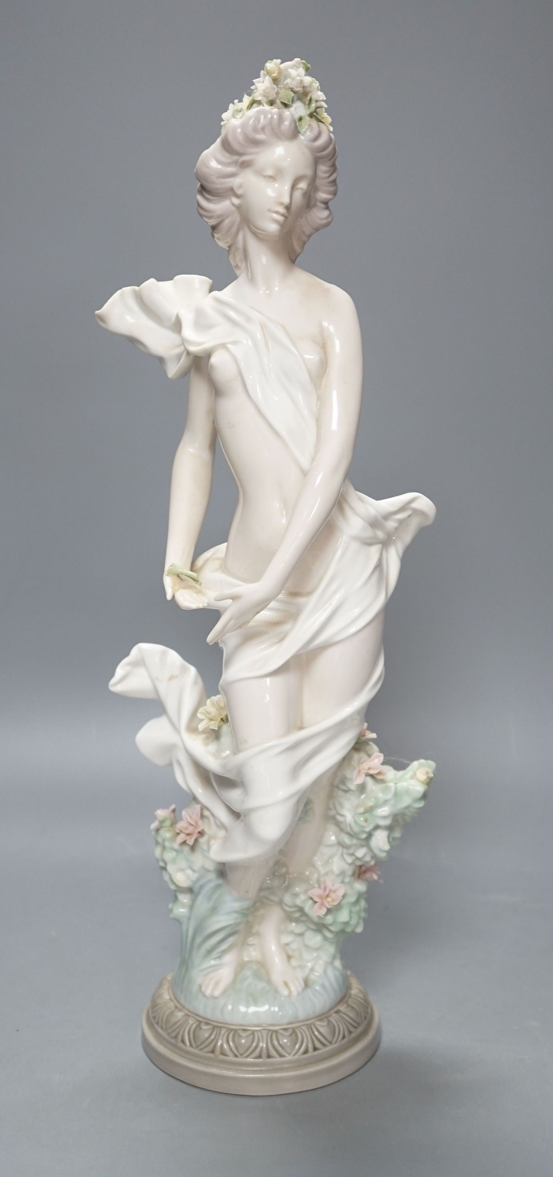 A Lladro female figurine, decorators signature on base, No 401, 41 cms.